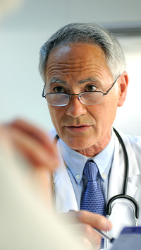 A doctor speaking to a patient