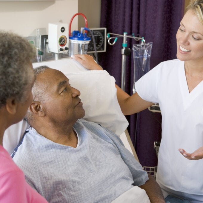 Doctor Explaining To Senior Couple