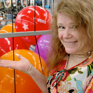 Woman in front of balls